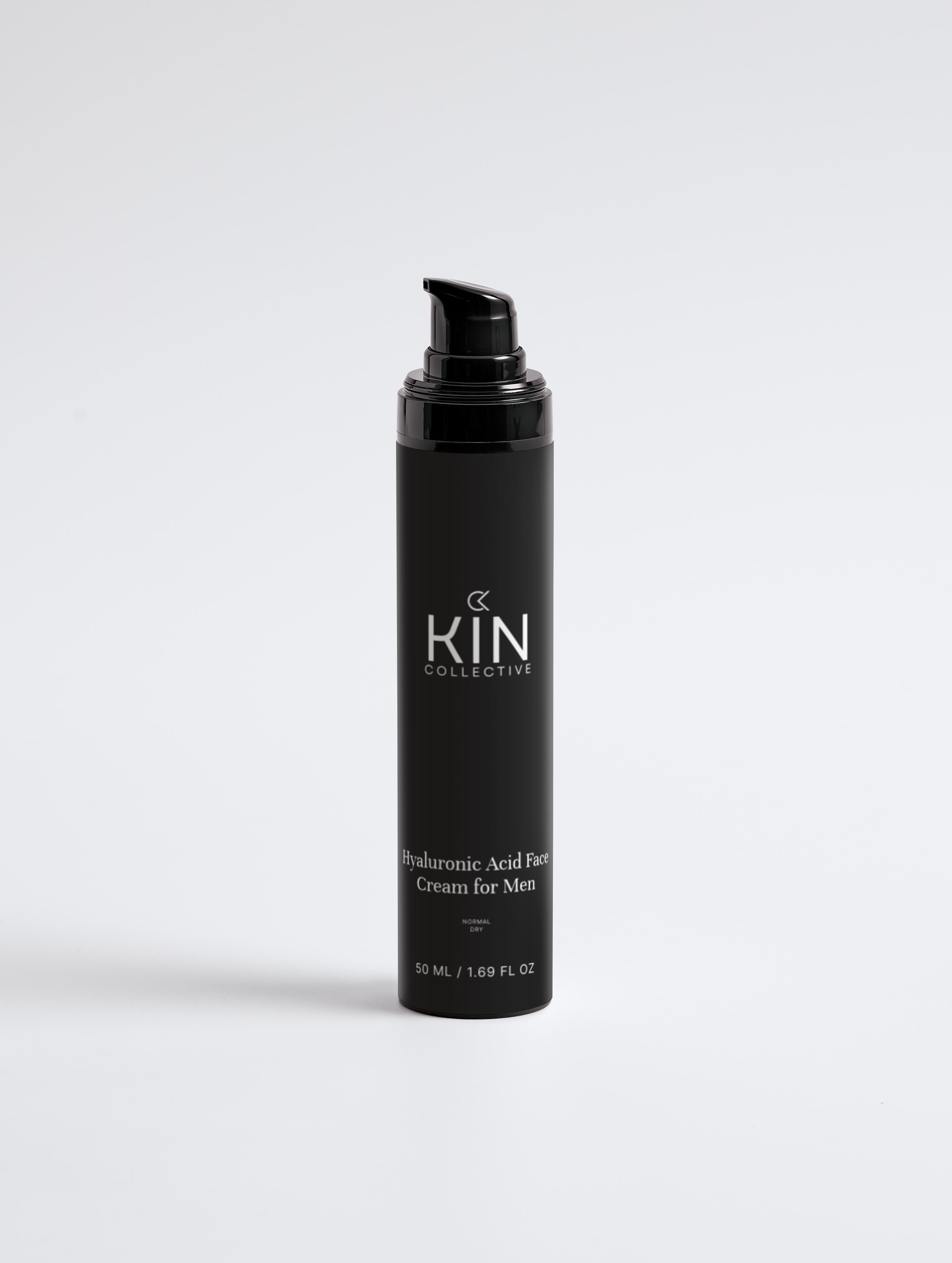 Black bottle of hyaluronic acid face cream for men on white background