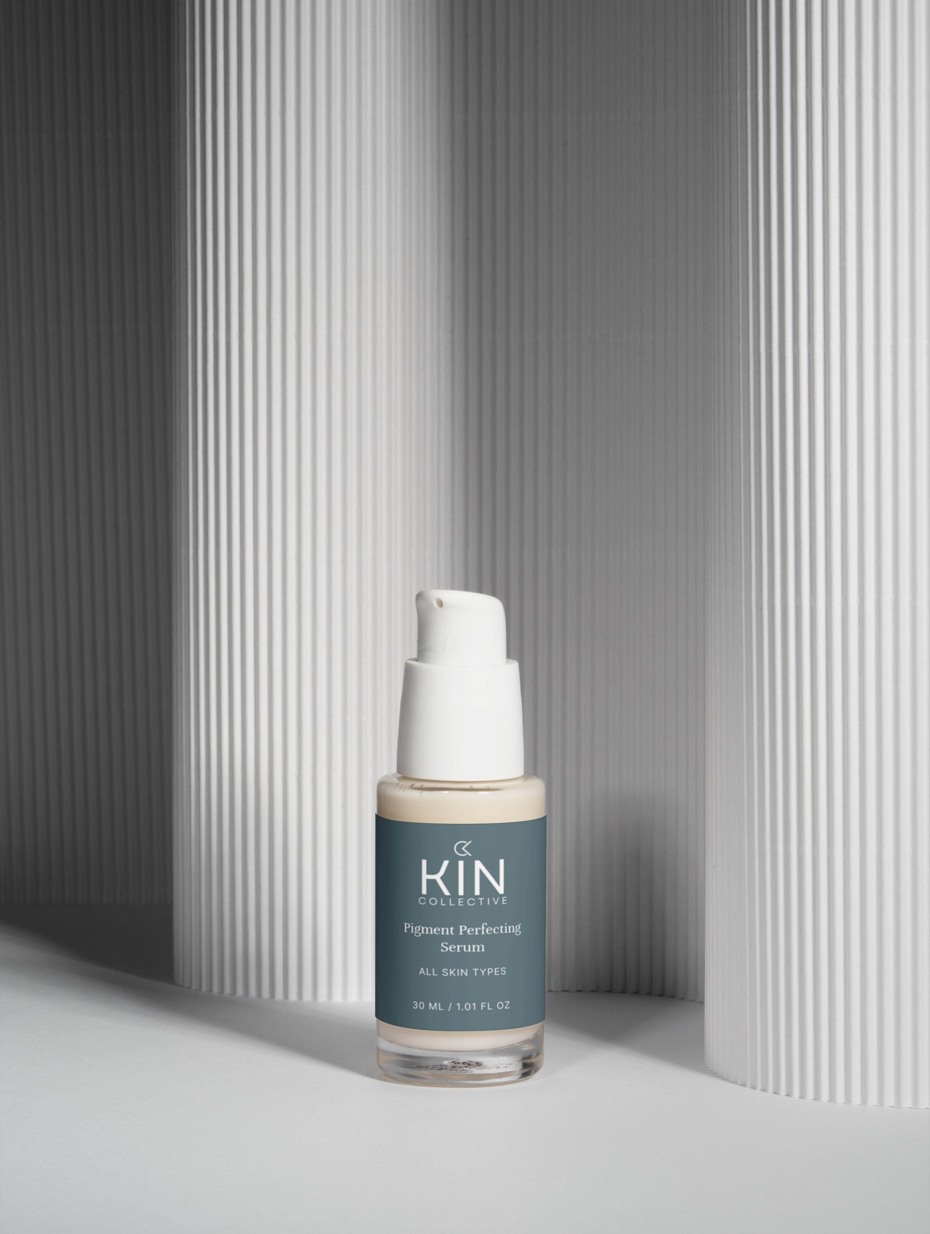 Kin Collective pigment perfecting serum bottle for all skin types on minimal white background