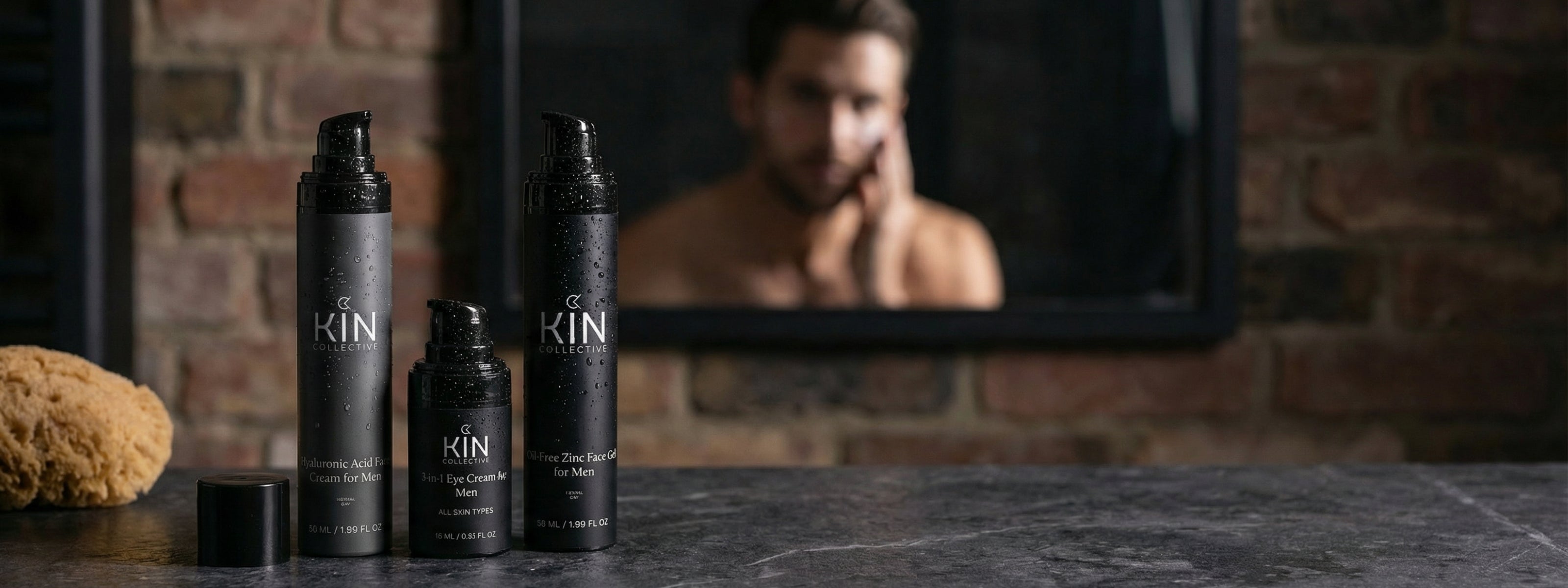Men's skincare products with water drops on bottles, blurred man applying cream in mirror