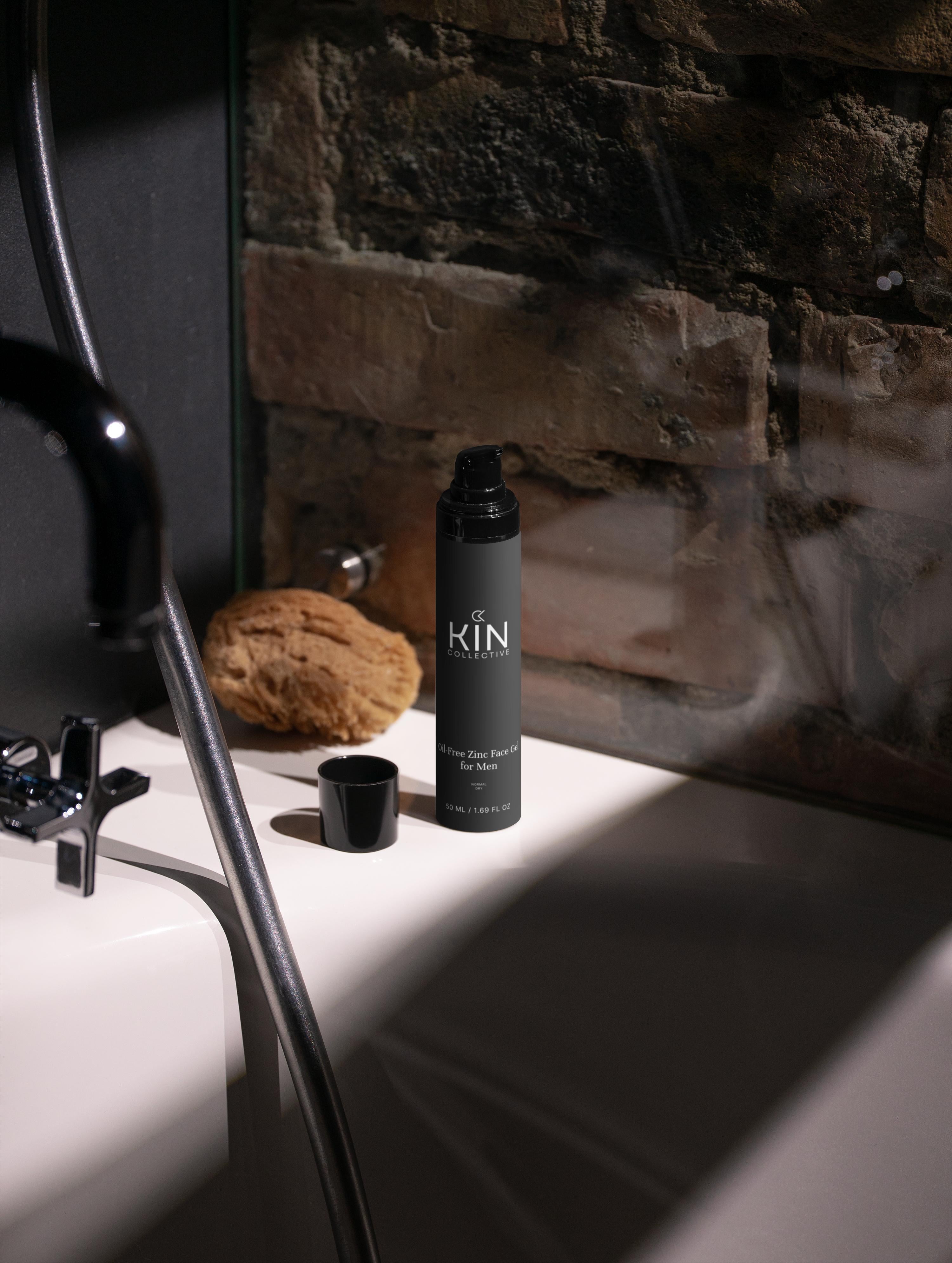 Men’s oil-free face gel bottle on bathtub edge with sponge and exposed brick background