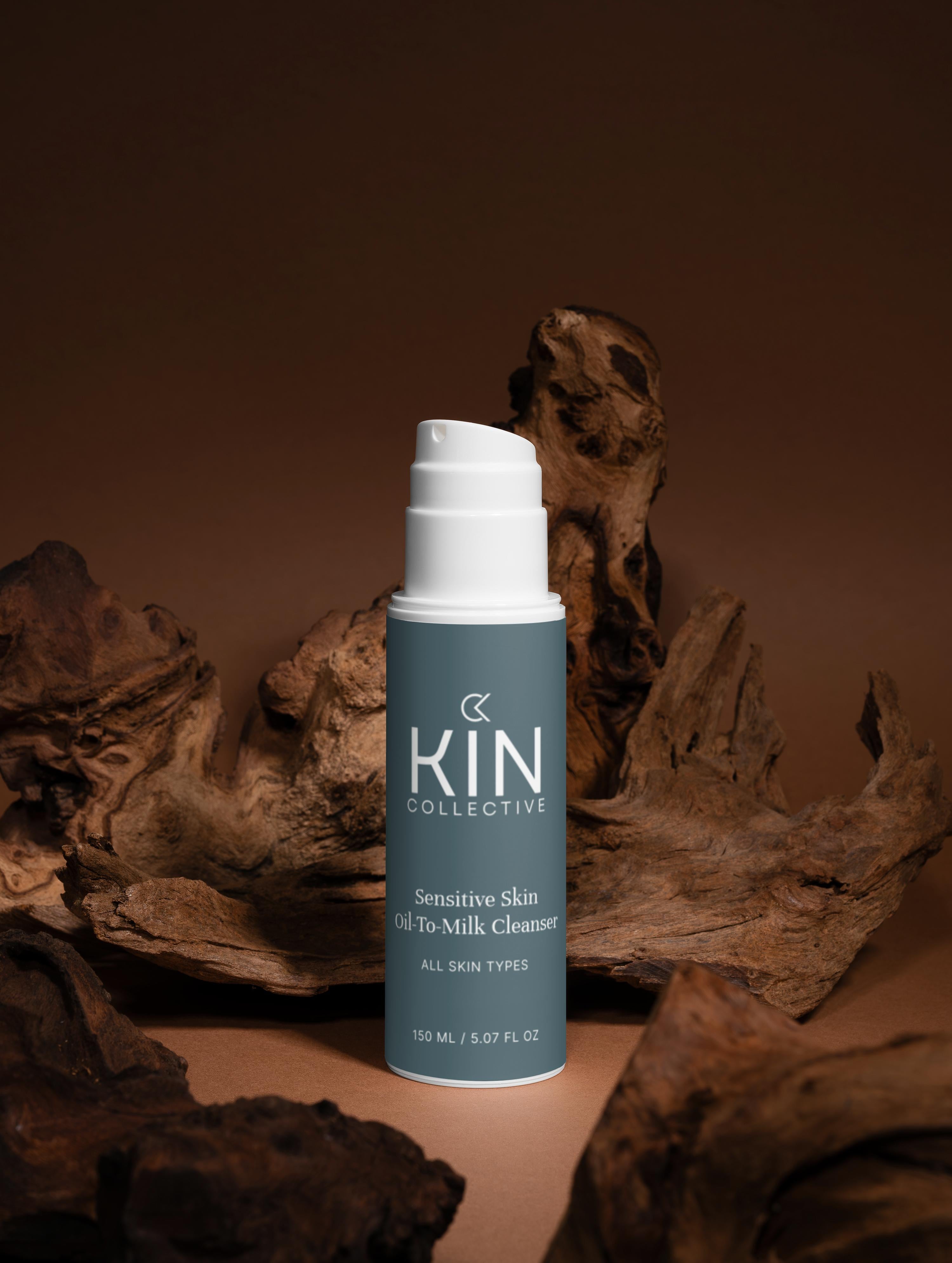 Sensitive skin oil-to-milk cleanser bottle for all skin types with wood accents, brown background