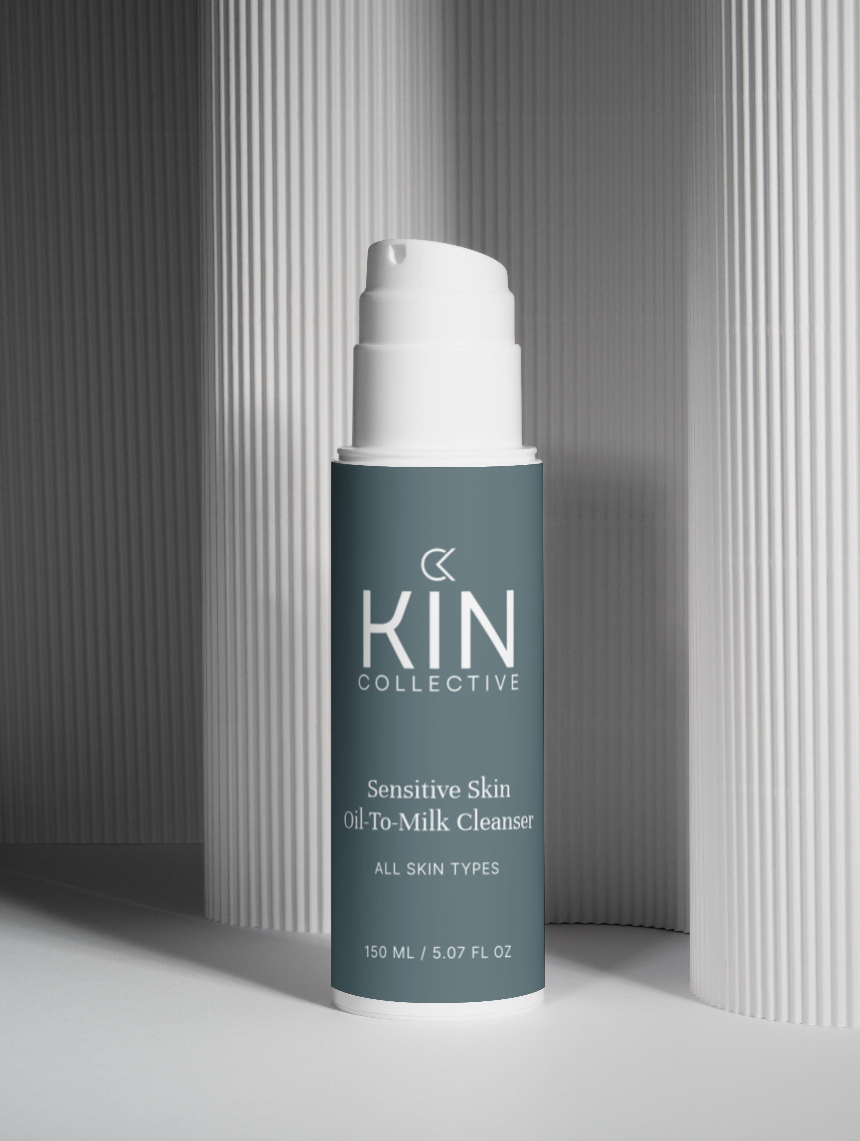 Sensitive skin oil-to-milk cleanser bottle for all skin types on a minimal background